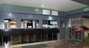 a lobby of a building with a bar in it at Hotel Corona Real in Mexico City
