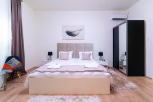 Postelja oz. postelje v sobi nastanitve Jevrejska - Central Apartment with Free Parking