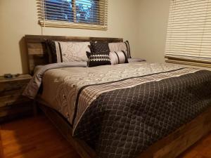 a large bed in a bedroom with a window at HEART OF Denver*Sleeps 10 in Denver