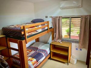 Postel nebo postele na pokoji v ubytování Yaxche Centro Hostal y Camping