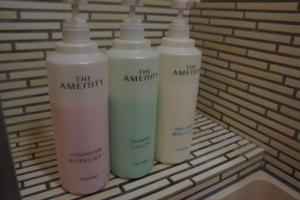 a group of three bottles sitting on a bench at Sumiyoshiya in Kanazawa