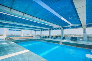 a swimming pool on the top of a building at Kemena Plaza Hotel in Bintulu