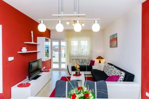 TV a/nebo společenská místnost v ubytování Apartments Palm tree