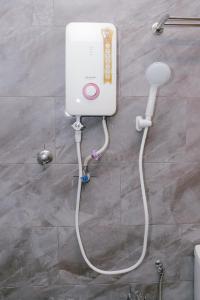 a water heater in a bathroom with at Langkawi Green View Cottage in Pantai Cenang +17 photos