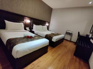 Postel nebo postele na pokoji v ubytování Castello Hotel