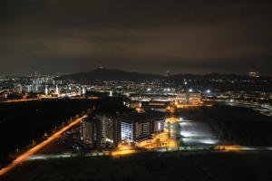 a view of a city at night with lights at Nur Ilan Homes by MSH in Kuala Lumpur