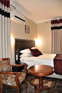 Een bed of bedden in een kamer bij Annavilla7 Lilongwe Aparthotel
