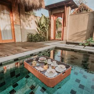 Swimmingpoolen hos eller tæt på Fivelements Retreat Bali