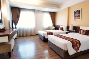 Postel nebo postele na pokoji v ubytování Avion Hotel + 18 fotografií