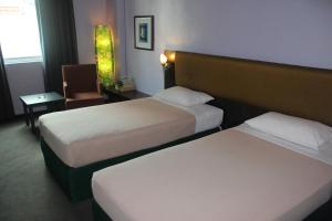 Letto o letti in una camera di Strand Hotel