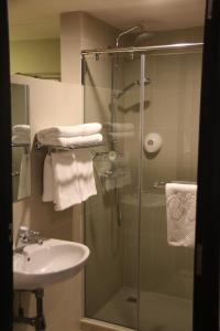 Ванная комната в Strand Hotel
