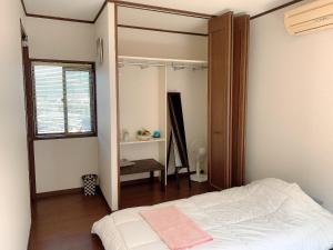Uma cama ou camas num quarto em Yufuin Sunday