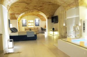 La Dimora delle Fate Luxury & SPA tesisinde bir oturma alanı