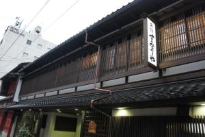 a building with a balcony on the side of it at Sumiyoshiya in Kanazawa