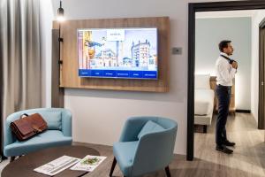 Telewizja i/lub zestaw kina domowego w obiekcie Novotel Parma Centro