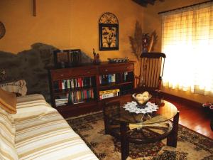 a living room with a couch and a chair and a table at Gemerendura in Blacha