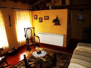 a living room with a couch and a table at Gemerendura in Blacha +2 photos