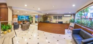 a lobby with a bar in a building at Hotel Casa Fortuna in Kolkata