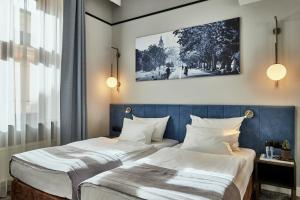 Posteľ alebo postele v izbe v ubytovaní Hotel Unicus Krakow Old Town - Destigo Hotels
