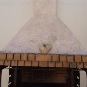 a brick stove top with snow on top of it at Villa Aposperitis in Panormos Rethymno