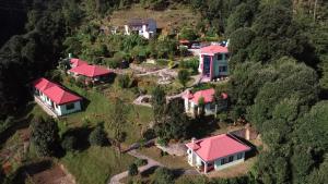 an aerial view of a house with red roofs at Himalaya Darshan Resort in Kausani
