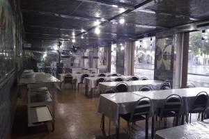 a dining room with tables and chairs in a restaurant at Hotel Barão De Tefé in Rio de Janeiro