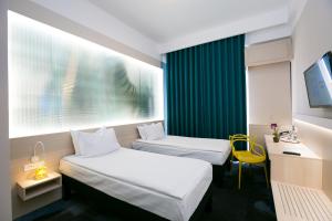 Krevet ili kreveti u jedinici u objektu ibis Styles Dunarea Galati