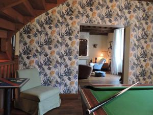 a room with a pool table and a living room at La Closerie Teranga in Bayeux +87 photos
