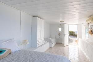 Postel nebo postele na pokoji v ubytování Sea Wind Apartments