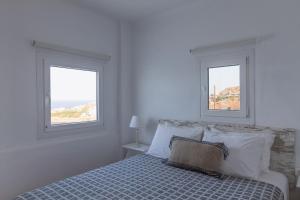 Postel nebo postele na pokoji v ubytování Sea Wind Apartments