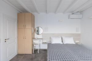 Postel nebo postele na pokoji v ubytování Sea Wind Apartments