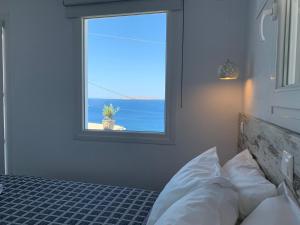 Postel nebo postele na pokoji v ubytování Sea Wind Apartments