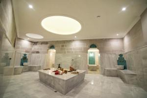 a large bathroom with a large tub in a room at Imperial Cave Suites & Spa in Göreme