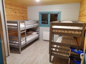 a bunk bed room with three bunk beds at Gîte Ker Koad in Pluduno +10 photos