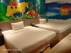 Postel nebo postele na pokoji v ubytování Legend Hotel Kaohsiung Pier2