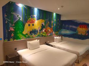 Postel nebo postele na pokoji v ubytování Legend Hotel Kaohsiung Pier2