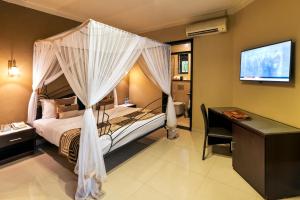 Voodi või voodid majutusasutuse Speke Resort and Conference Center toas