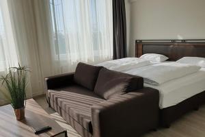 Postel nebo postele na pokoji v ubytování Motel Plus Schönefeld