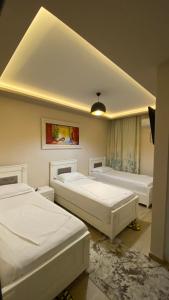 Кровать или кровати в номере Hotel Universi