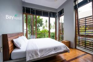 Ein Bett oder Betten in einem Zimmer der Unterkunft Bay Villas Koh Phangan