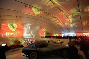 a room with a car on display in a museum at Hotel Stella in Modena