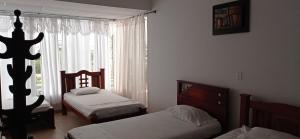 Postel nebo postele na pokoji v ubytování Hotel Los Estoraques