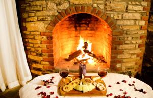 a table with a tray of food in front of a brick oven at Pir Efes Konakları in Izmir