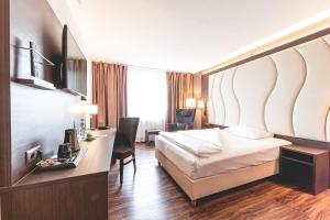 Postel nebo postele na pokoji v ubytování PLAZA Hotel Hanau