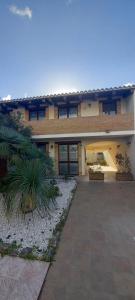 a large house with a driveway in front of it at B Holidays Casa Vacanze in Càbras