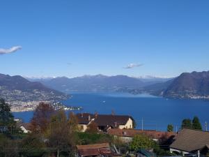 a view of a large body of water with mountains at Casa Elisa in Stresa