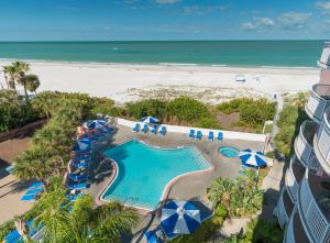 an aerial view of a resort with a pool and the beach at Beach House Suites by the Don CeSar in St. Pete Beach