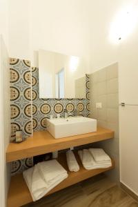 Postel nebo postele na pokoji v ubytování Oasi Guzzetta Hotel&Case Vacanze