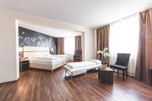 Postel nebo postele na pokoji v ubytování PLAZA Hotel Hanau