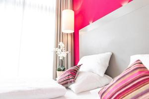 Postel nebo postele na pokoji v ubytování PLAZA Hotel Hanau